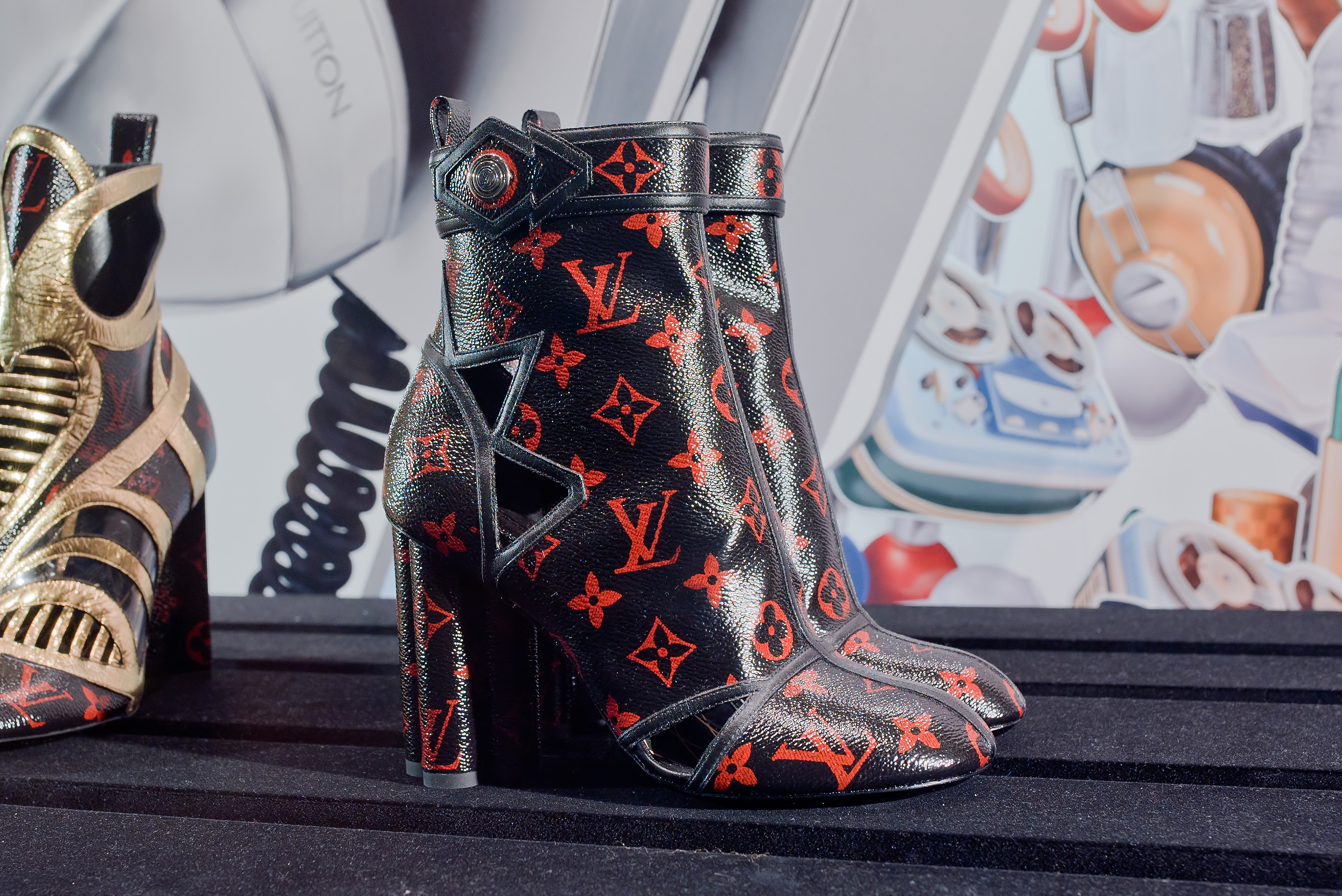 Louis Vuitton boots in red and black patent Monogram canvas